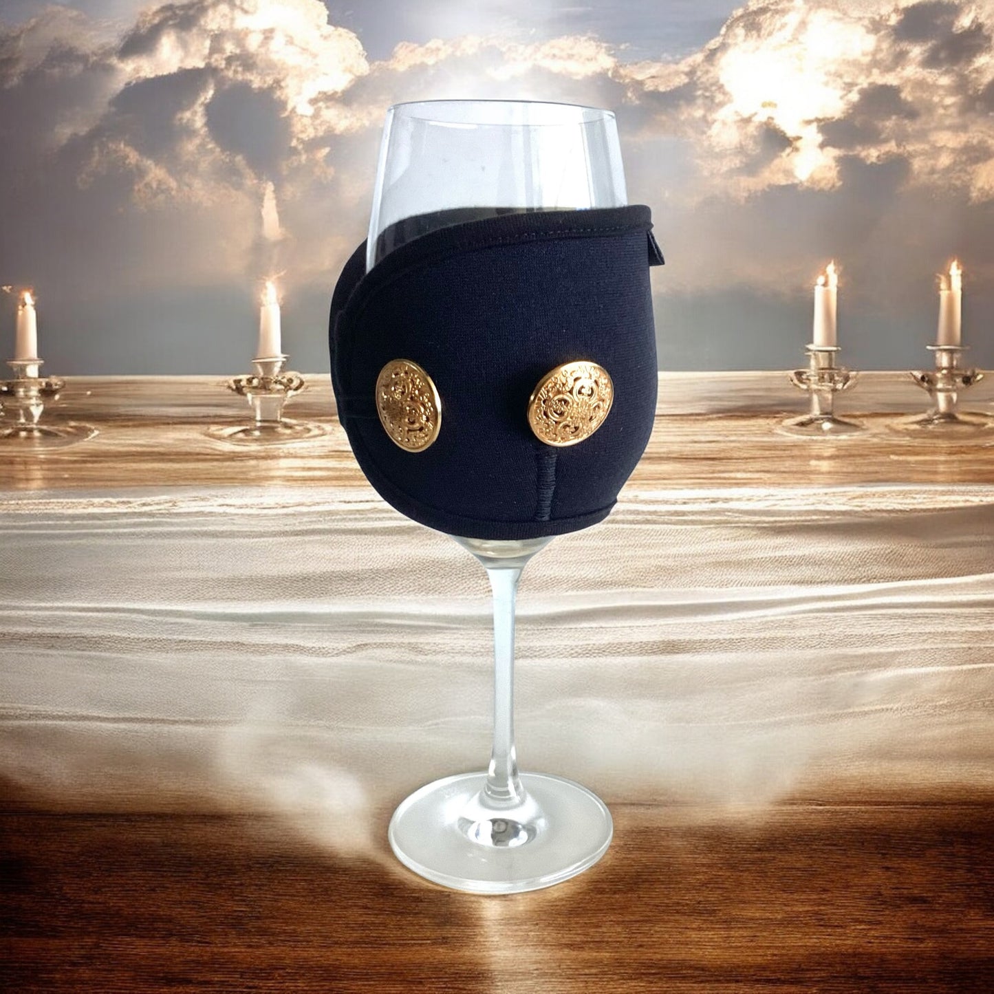 Wine glass with candles in background